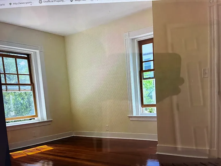 The master bedroom has beautiful hardwood flooring, expansive windows and spacious closet space.