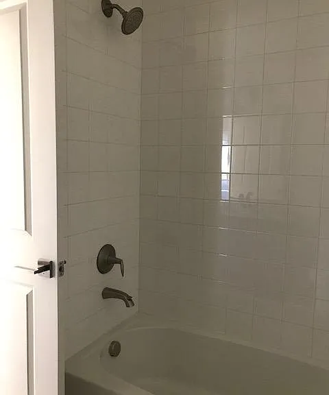 2nd bathroom upstairs has tub/shower combo and tile to the ceiling