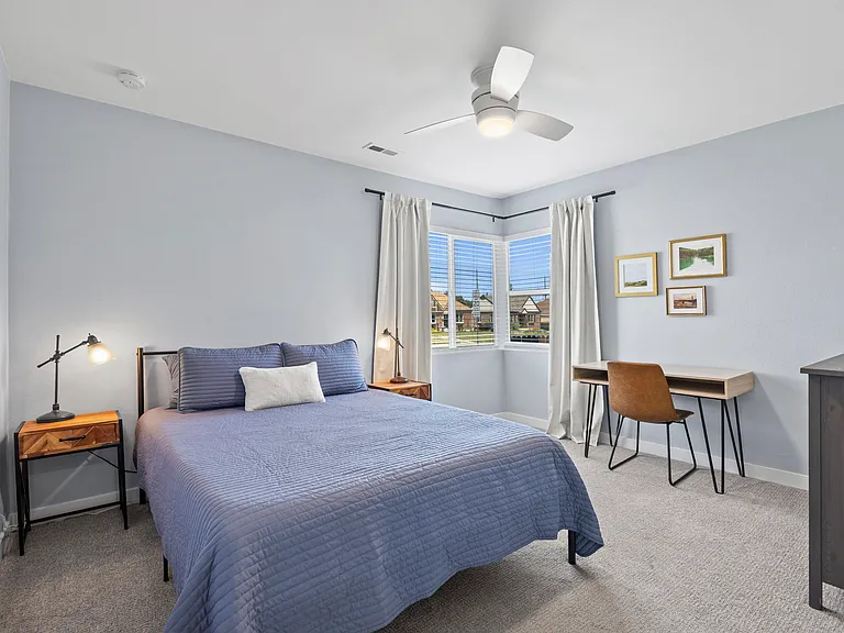 Second light-filled bedroom. Also great for guests or a separate workspace. Blackout curtains on all windows.