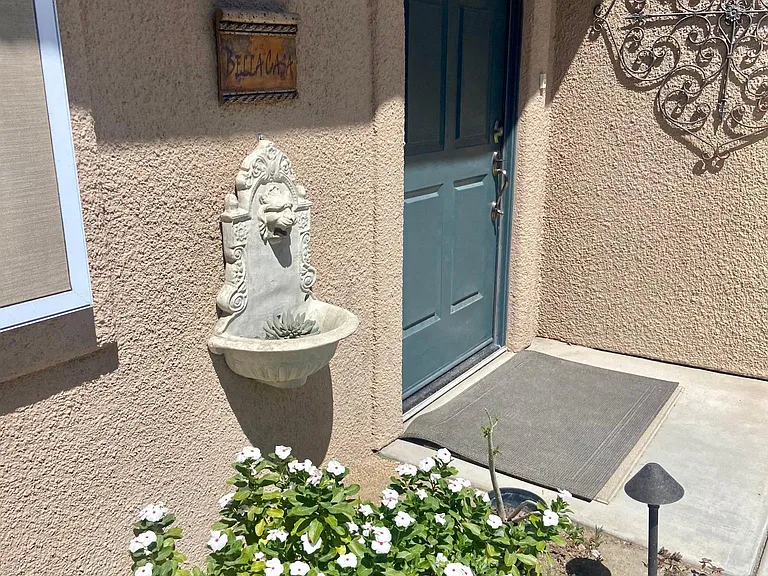 Front door to home from your private gated side yard.