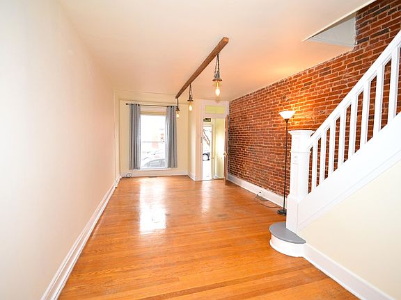 Open floor plan with hardwood floors