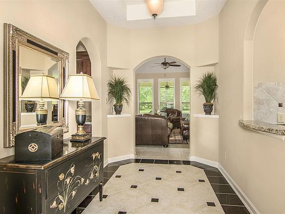 Foyer showing entrance on left to Workspace area and opening straight ahead enters the family room.