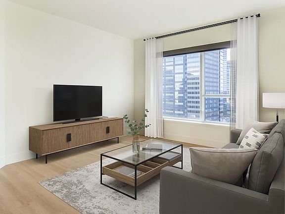 Renovated Package I living room with hard surface flooring