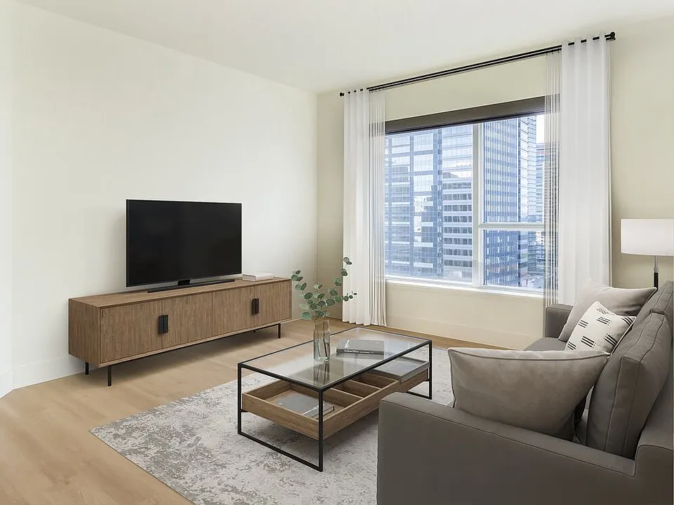 Renovated Package I living room with hard surface flooring