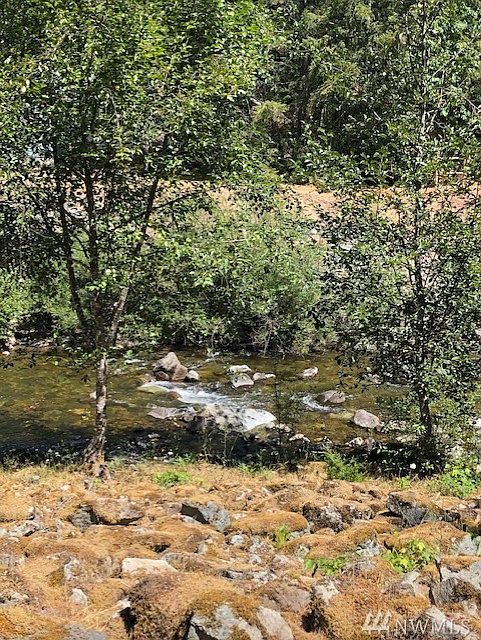 Beautiful 60' Butter Creek Waterfront!  2 RV hook-ups and outbuilding to include Cabin/Shed!