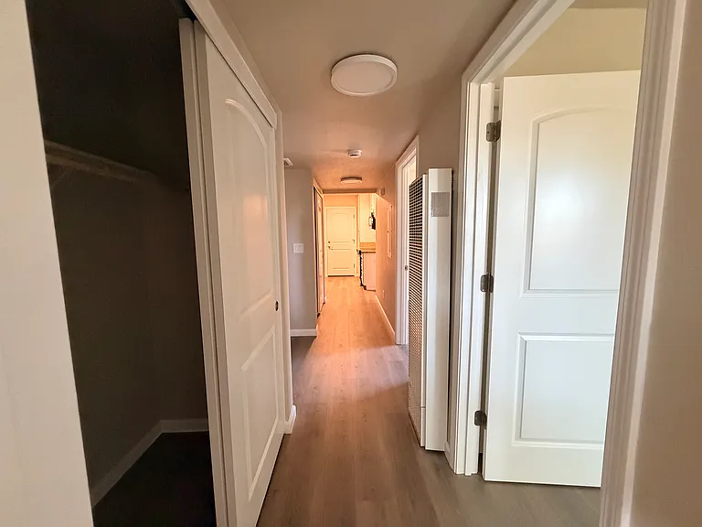 End of hallway looking into kitchen.
