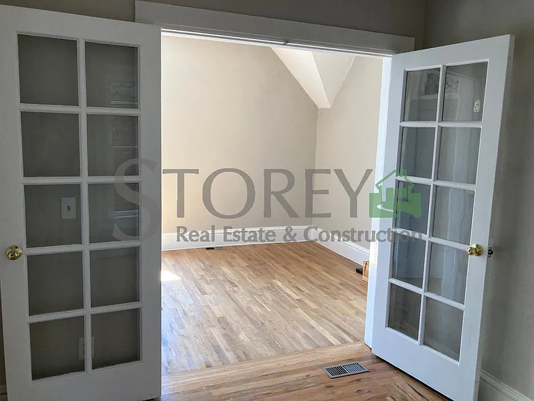 Second level bedroom #2 adjoined by French doors to bedroom #3