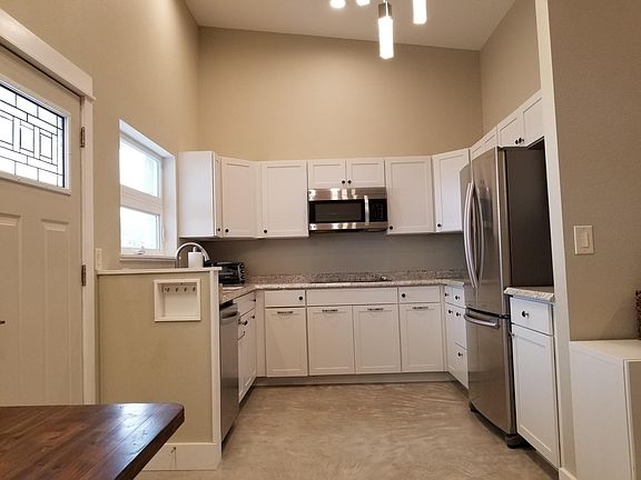 Kitchen has plenty of light.