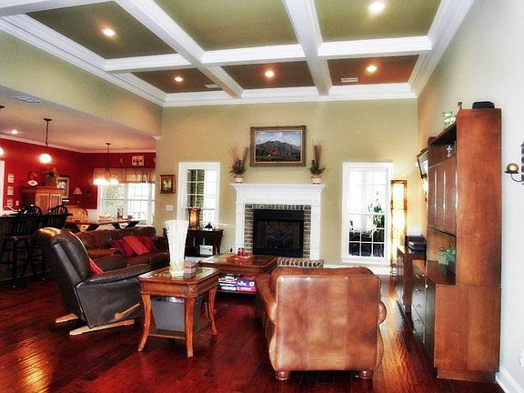 main living area with coffered ceilings
