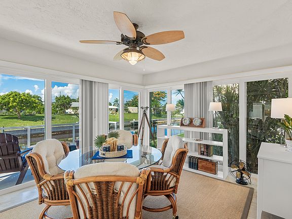 Dining area with expansive view of long canal open sky.