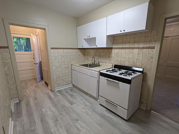 Kitchen with updated flooring.