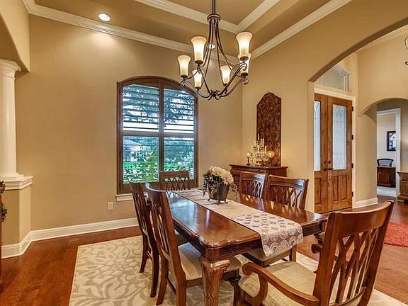 Nothing says welcome everyone more than a beautiful formal dining area.  Trey ceilings, Shuttered windows. Hardwood floors. All the crown moulding.  Let's have a formal dinner party here.