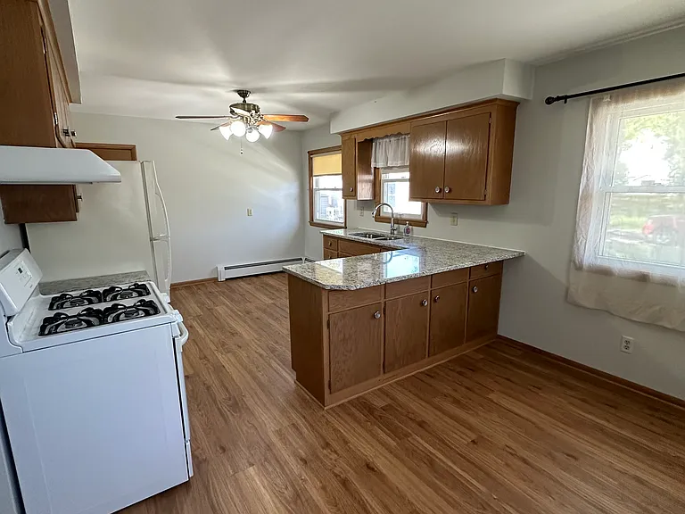 Spacious kitchen with new granite countertops and tons of natural lighting.