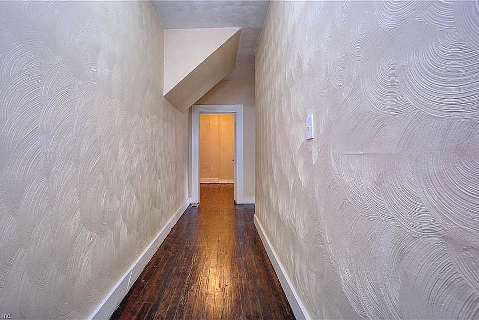 Unit #1 features hardwood floors and high ceilings.