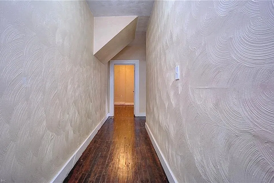Unit #1 features hardwood floors and high ceilings.
