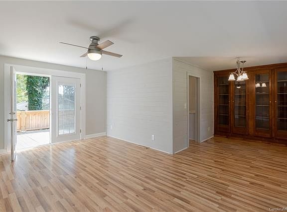 From front door looking onto back deck and dining on left (kitchen is through the door).