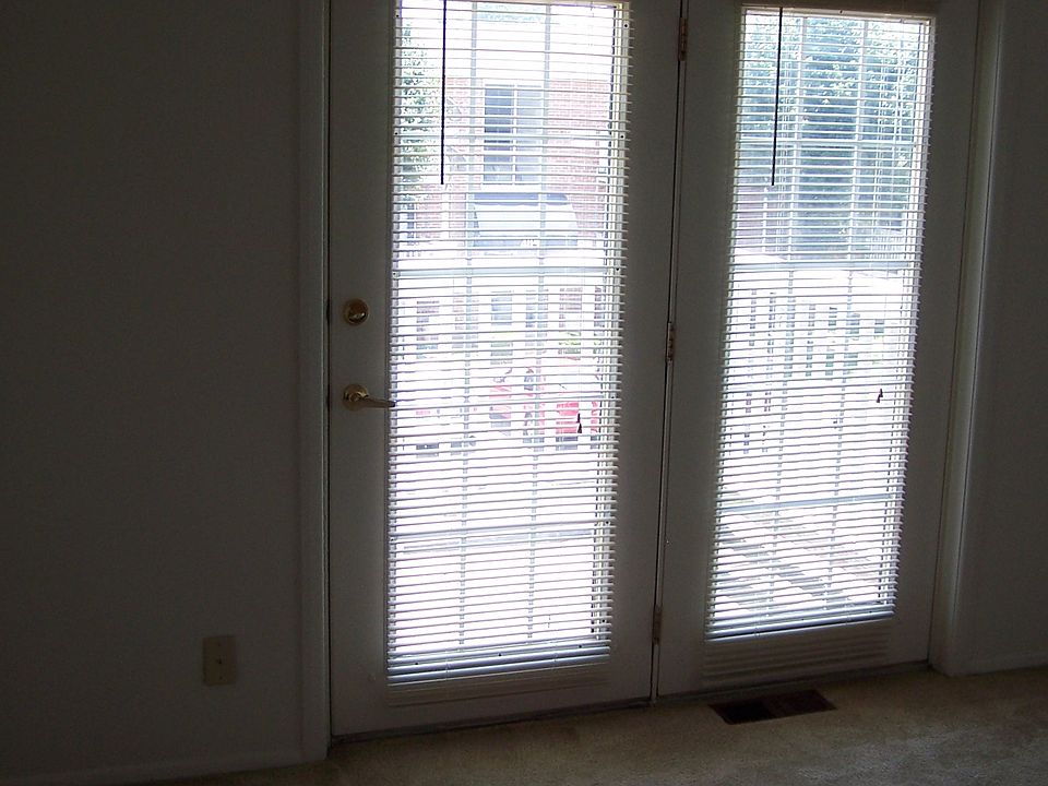 Living Room with French Door to balcony.