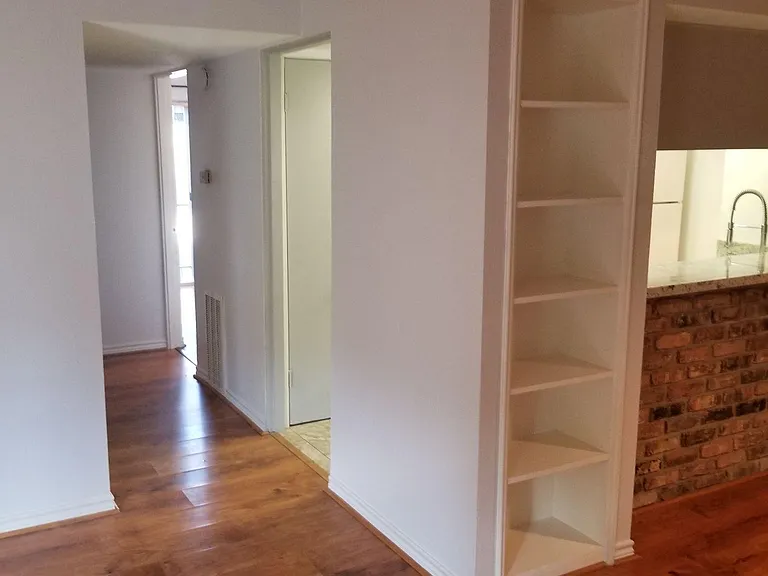 Bright Hall leads to two bedrooms.