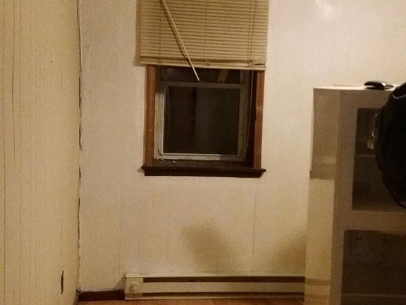 Kitchen/Living area. (Painted, new ceiling tiles)