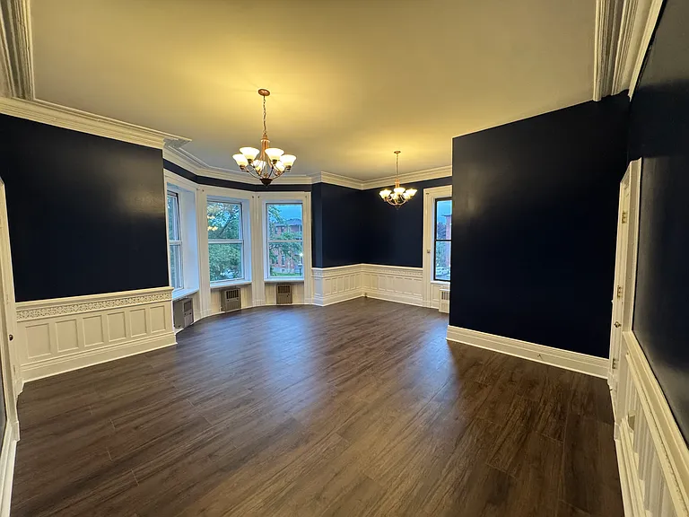 Large spacious living room with lots of windows and high ceilings