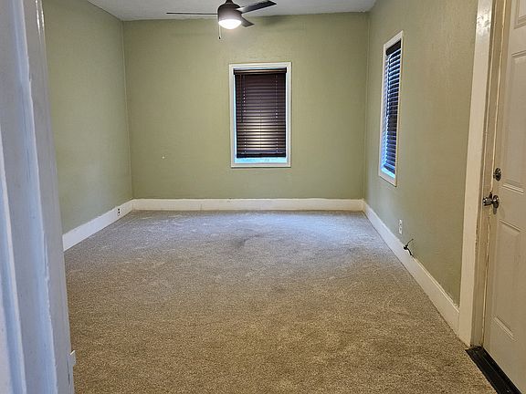 Large Living Room / Dining Room with new carpet and new Energy Efficient Windows.