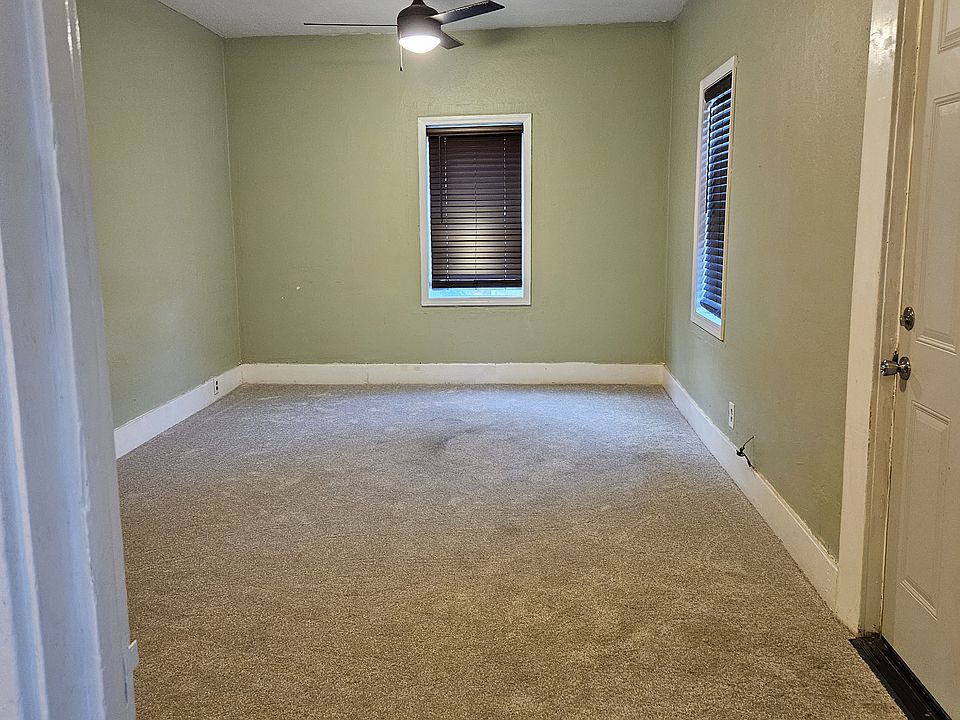 Large Living Room / Dining Room with new carpet and new Energy Efficient Windows.