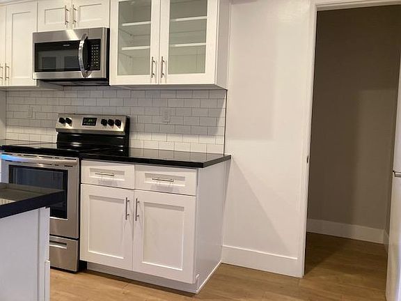 Kitchen has bonus storage for pantry or bike