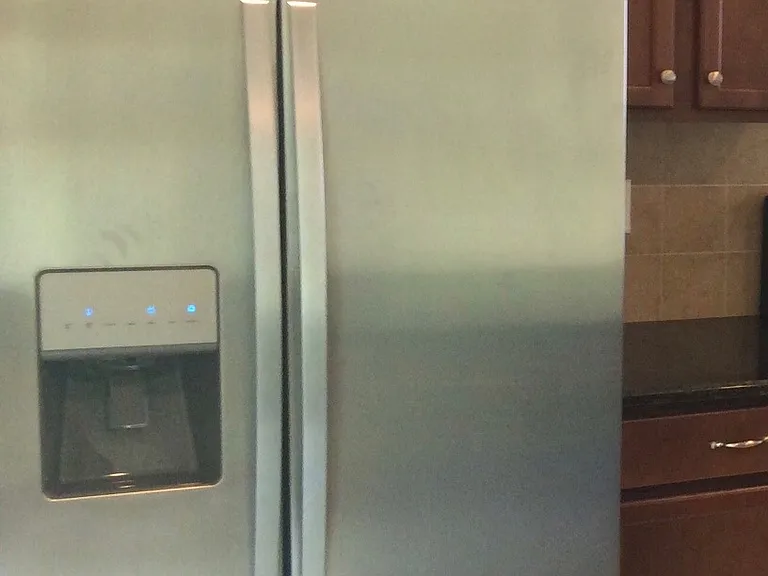 Tall Cabinets | Double door Whirlpool refrigerator with Large freezer and water dispenser