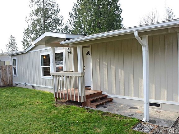 Front of home with covered front porch to keep you try!