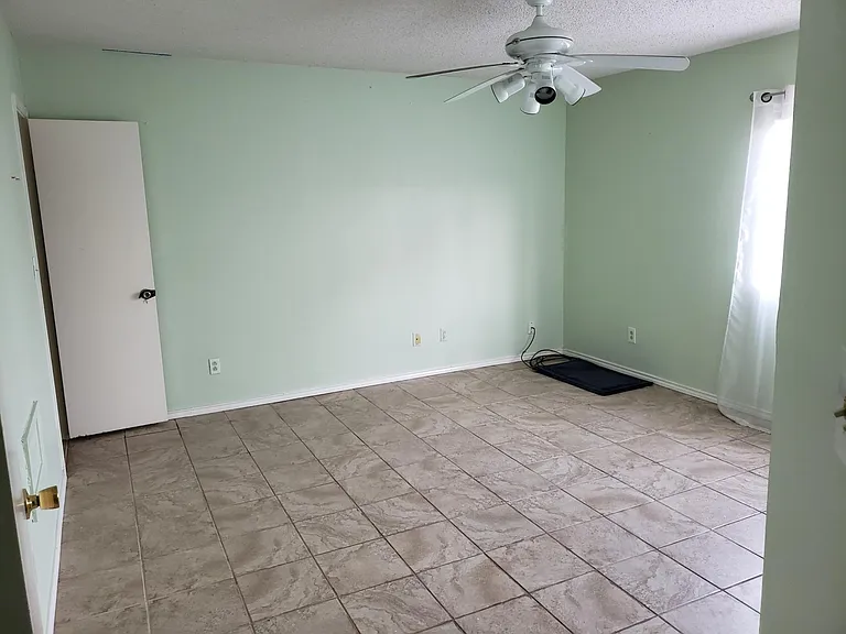 Looking the doorway of the master bedroom.