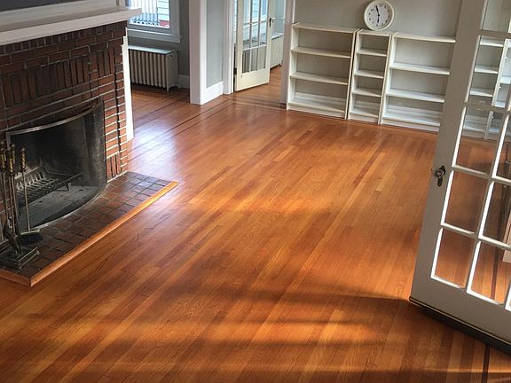 Living Room with working fireplace and bookcases.