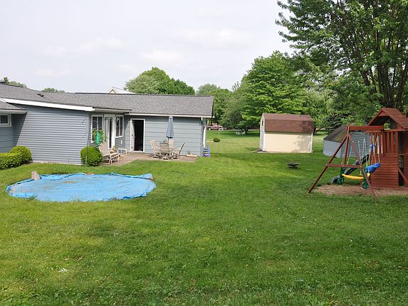 Back yard with level area for above ground pool! Shed included.