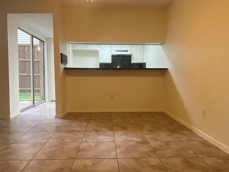 Breakfast area has a bar top for serving or sitting.