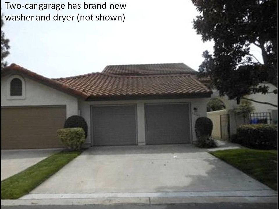 Two-car garage has brand new washer and dryer (not shown)