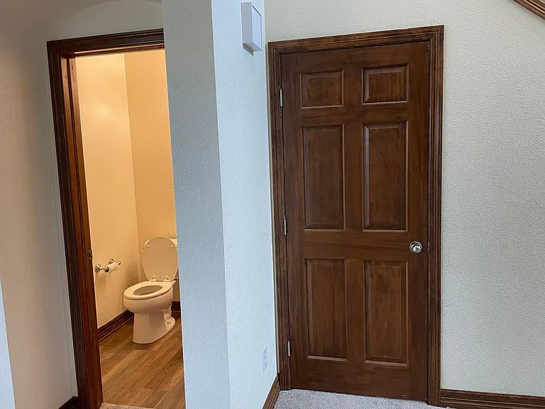 Half bath and door to the basement