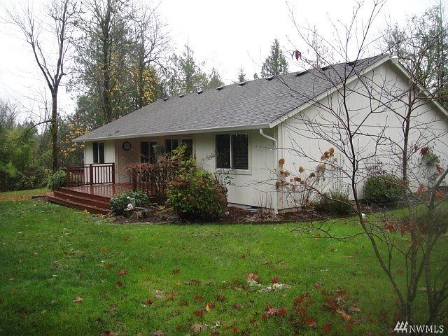 The back deck overlooking the yard and the second lot.
