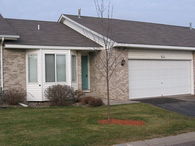 All brick front on Rambler/Ranch style town home.