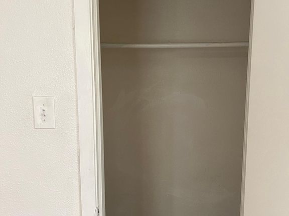 Roommy walk in closet in bedroom