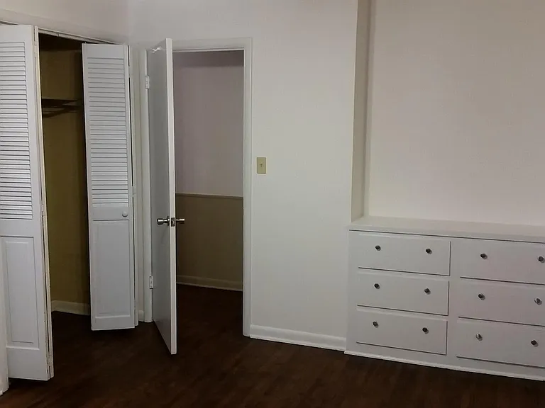 Second bedroom has a built in dresser.