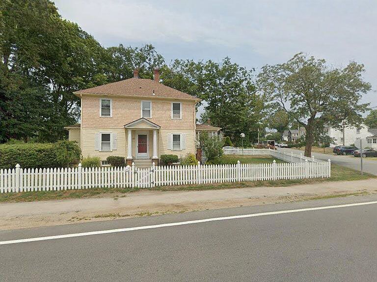 Classic New England charm with a white picket fence and great curb appeal.