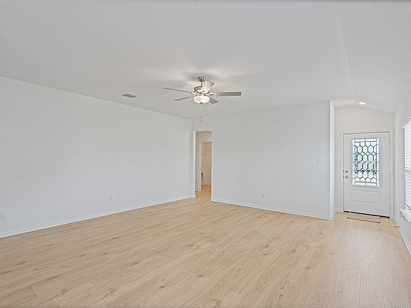 Open layout with a large living room that the kitchen overlooks