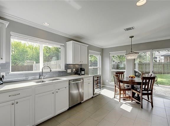 Windows, windows, windows (sliding door). Light just pours into the kitchen/breakfast nook. Perfect for quick get away bites or informal meals with the family.