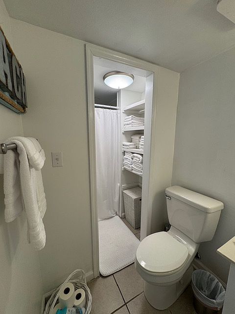 Downstairs bath with linen closet and shower. Across from kitchen.