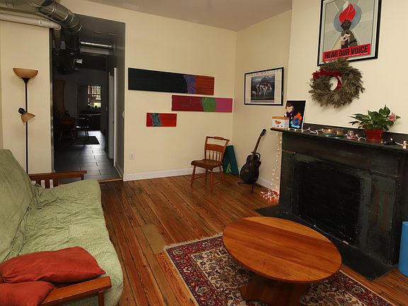 living room with view to kitchen and rear bedroom