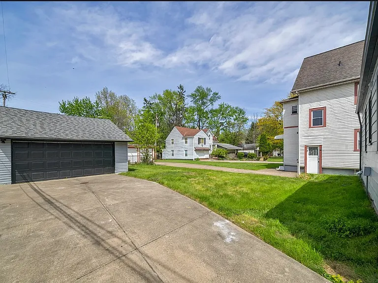 Nice backyard with a 2 car garage and private driveway parking.