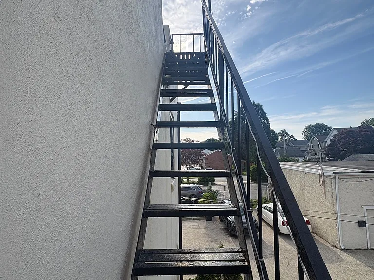 Fire Escape / Stairs to parking lot & garbage