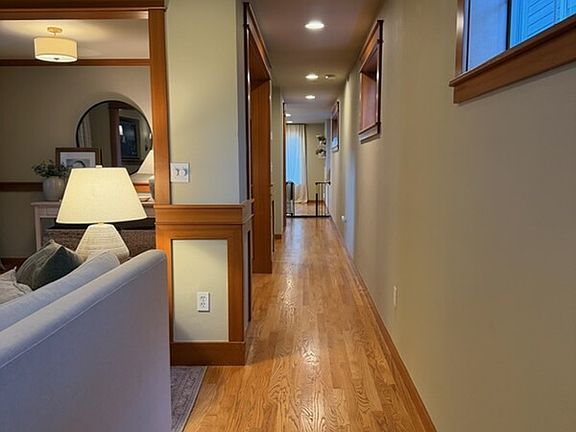 Front door entrance and looking at living room to the left and kitchen straight ahead.