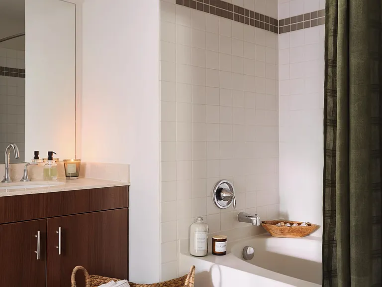 Designer bathrooms feature quartz countertops and ceramic tile flooring*.