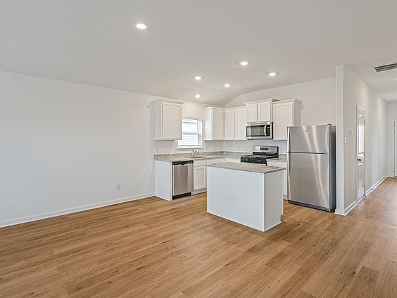 A long foyer leads you to the gorgeous kitchen