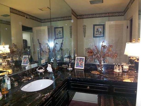 Elegant Powder room with marble vanity.